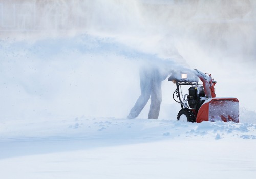 Professional using a heavy duty snow blower during Snow Removal in Bartonville IL