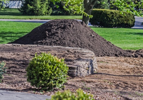 A Mound of dirt in a front yard, as part of Landscape Products in Peoria IL