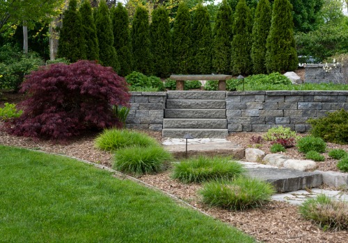 A garden in a back yard with Retaining Walls in Peoria IL