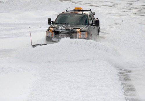 A truck plowing snow, as a part of Commercial Snow Removal in Companies Bartonville IL