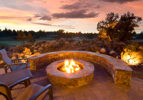 Outdoor furniture and a brick wall around Fire Pits in Peoria IL